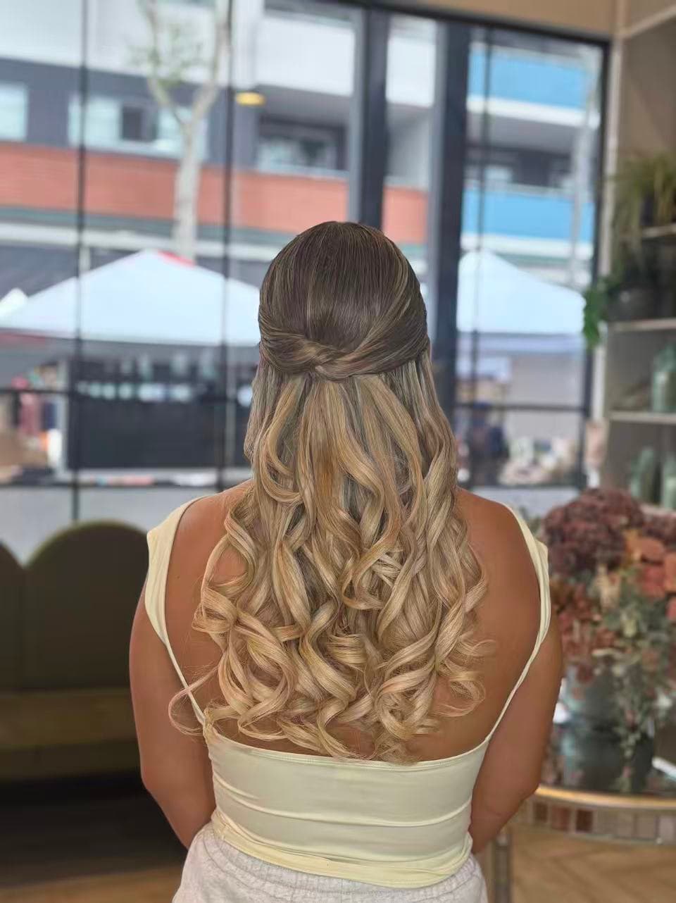 Blonde half-up formal curls by Didi at Hair Talks Rouse Hill