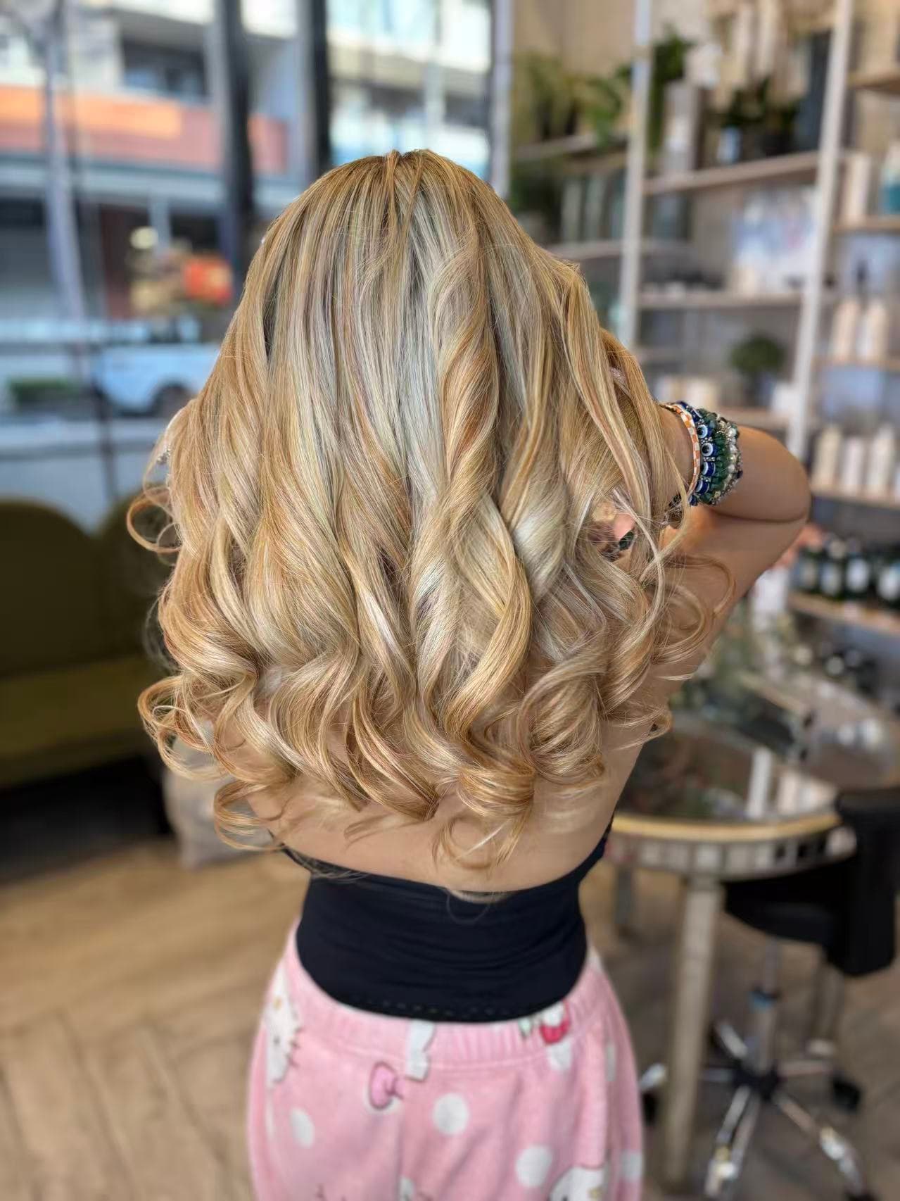 Glamorous blonde curled finish by Didi at Hair Talks Rouse Hill