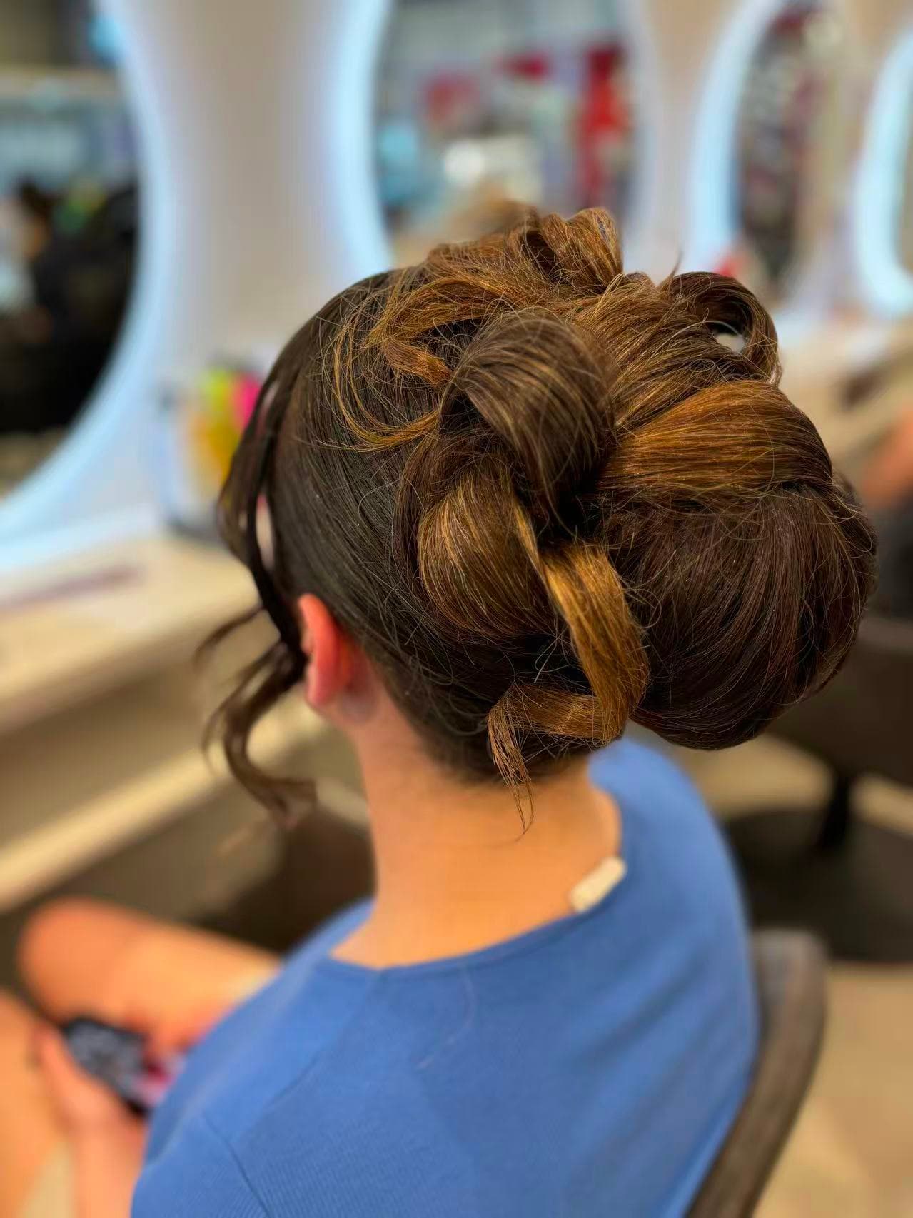 Elegant sculptural brunette bun updo by Didi at Hair Talks Rouse Hill