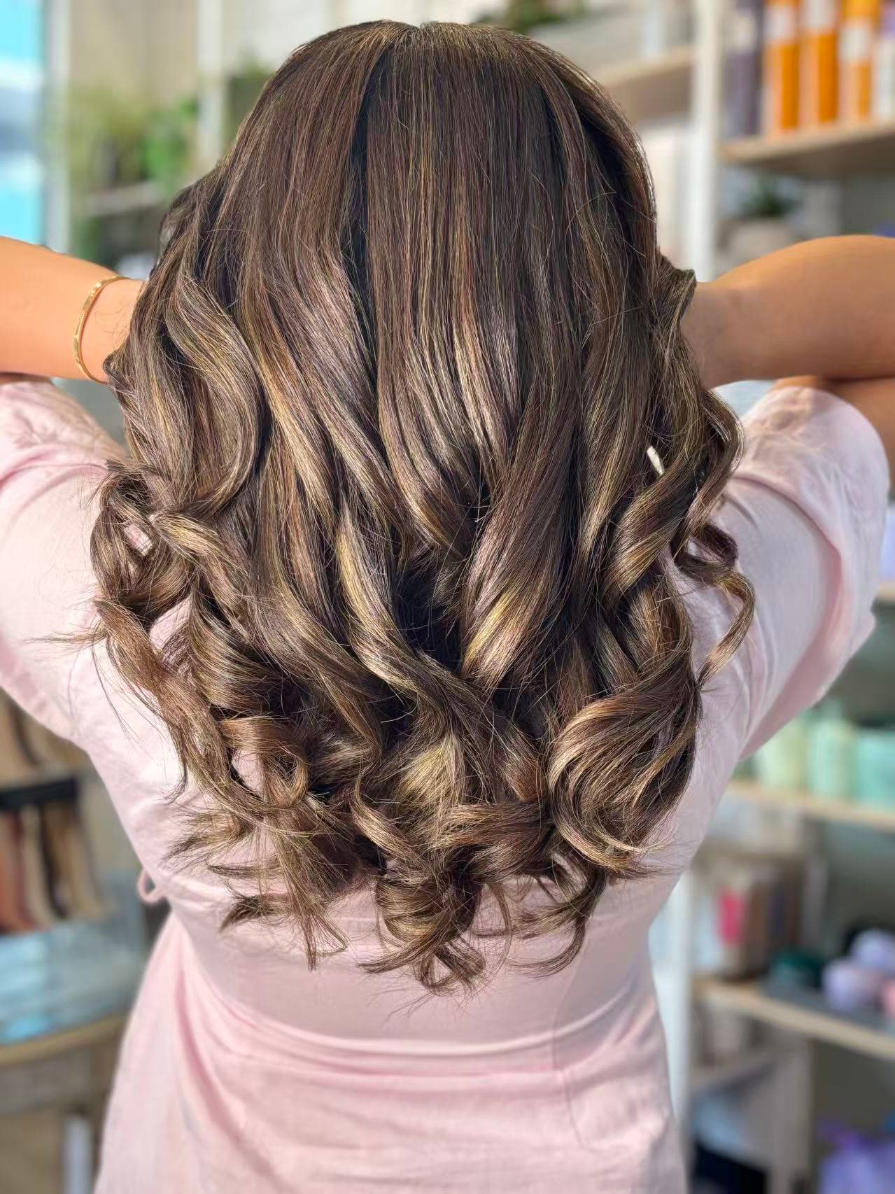 Dimensional brunette colour with curls by Didi at Hair Talks Rouse Hill
