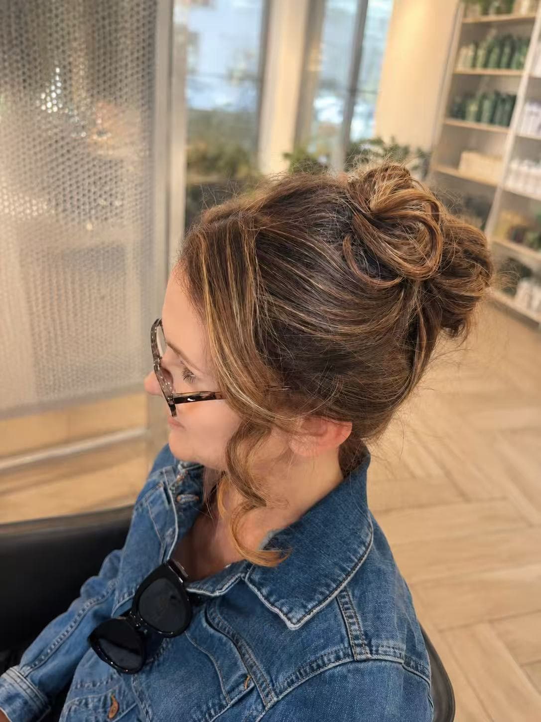 Casual top bun with balayage highlights by Sharon at Hair Talks Rouse Hill